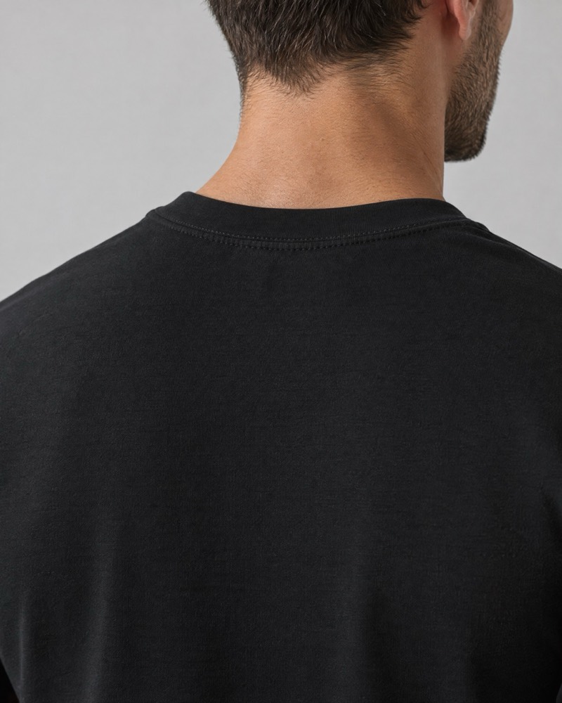 Back of the neck and shoulders in a heavyweight onyx interlock tee