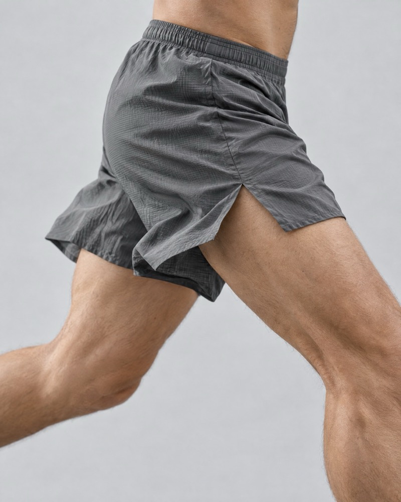 Graphite ultralight run shorts lifting mid-stride